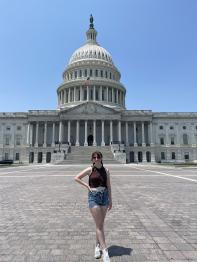 Woman standing infront of the US Capital building